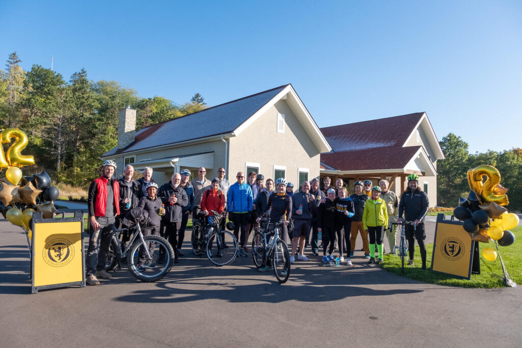 Group at end of ride, flanked by St Olaf billboards